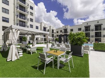 spacious sun decks with private cabanas | District West Gables Apartments in West Miami, Florida